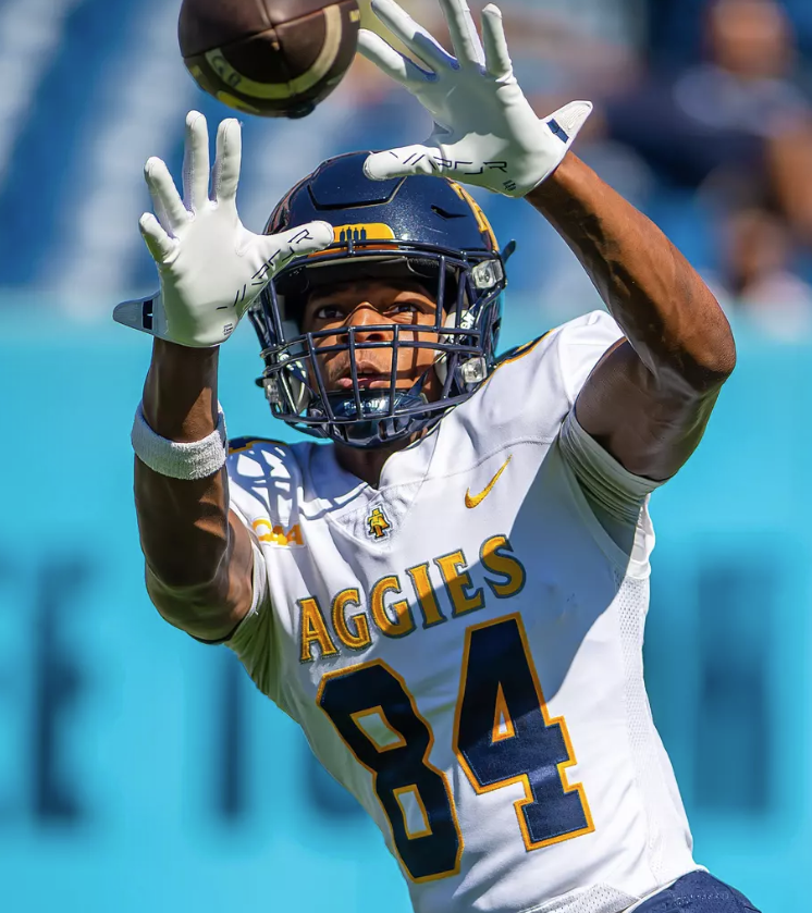 A&T football player about to catch a pass