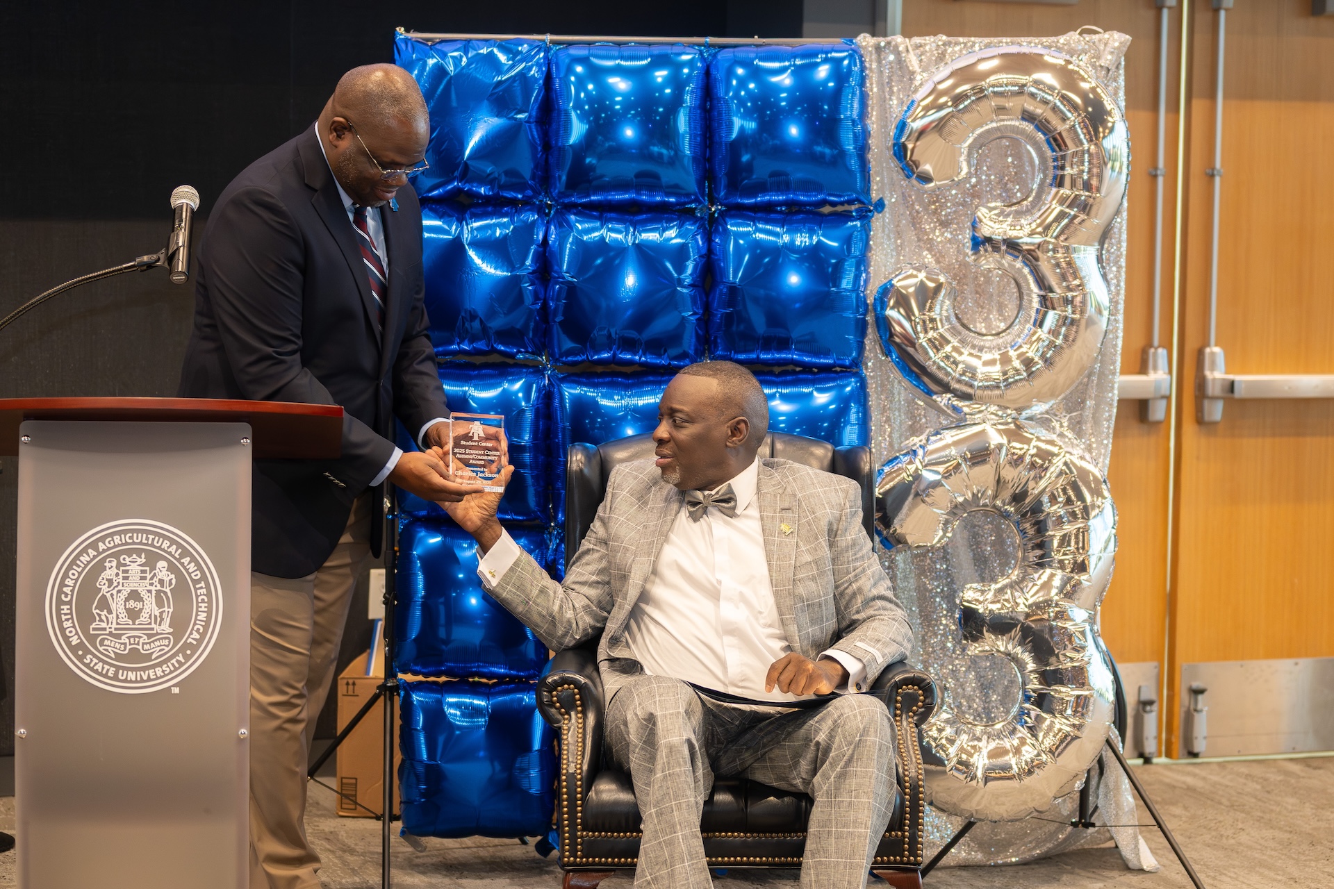 Executive Director Robert McNair and award recipient Charles Jackson