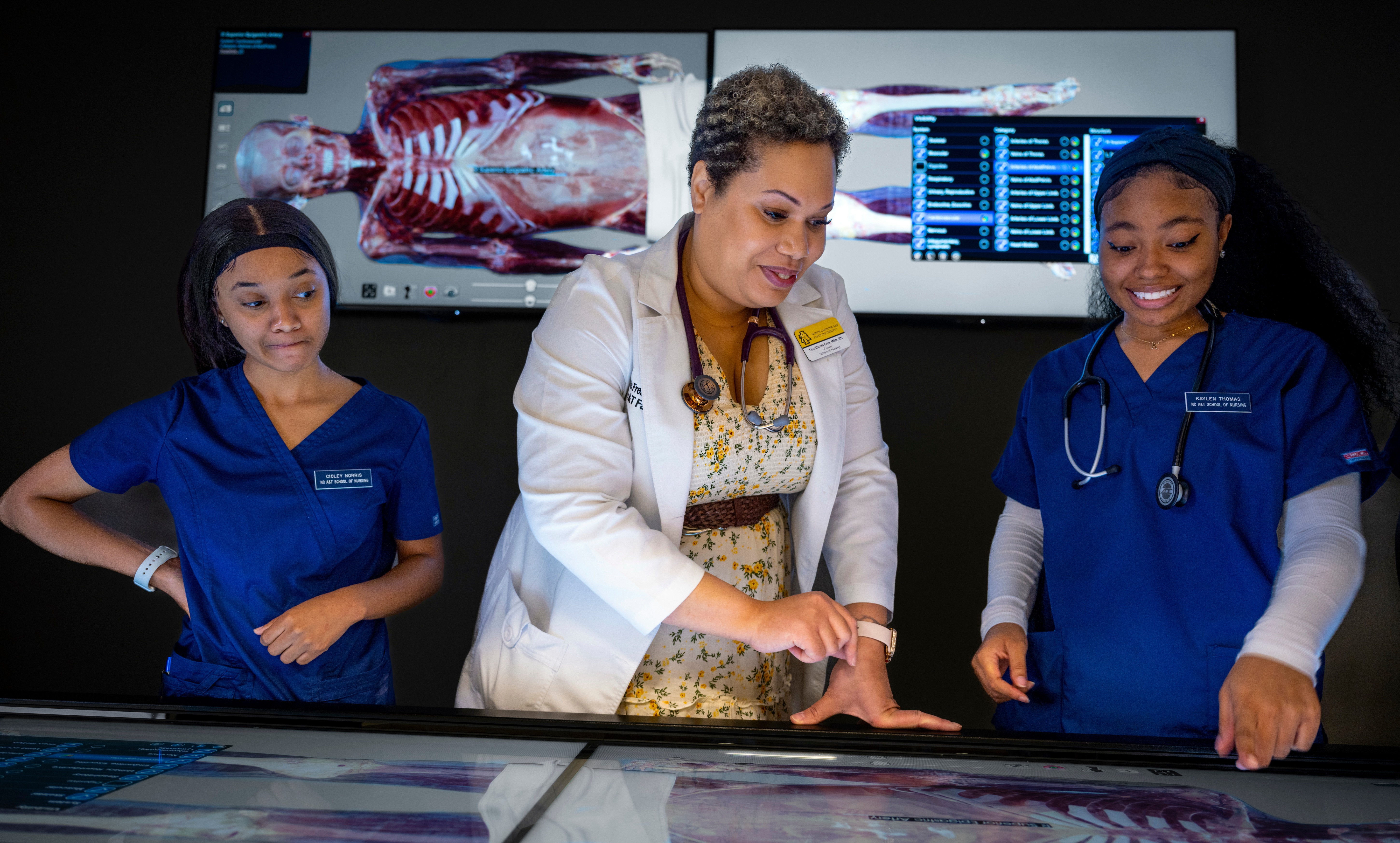 Image of students and a professor in the CHHS.