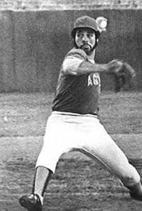 Al Holland Sr. pitching in his Aggies baseball uniform
